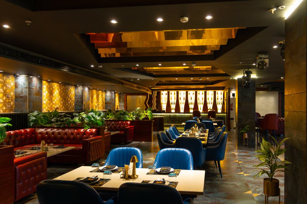 Bellers, tables laid under the backlit bottle wall