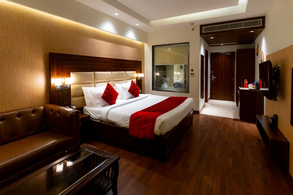 An Executive Room with its leather sofa and wall-mounted screen