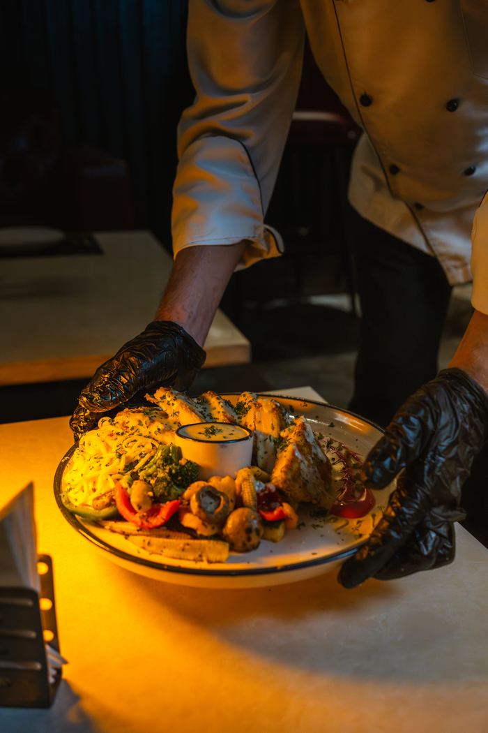 The kitchen plating a dish