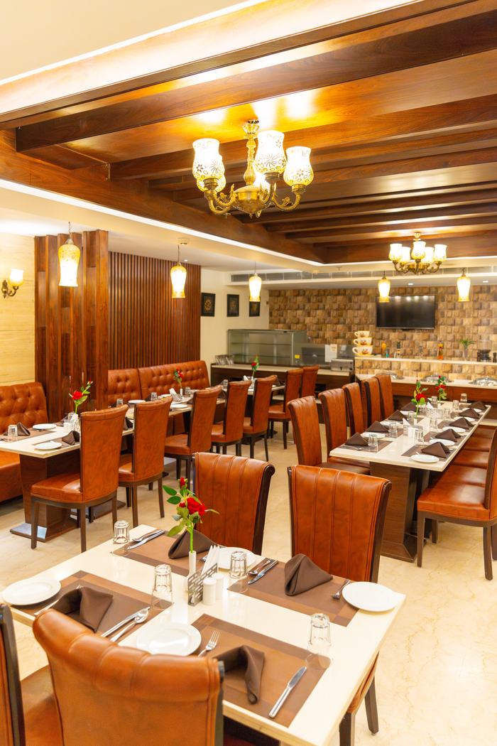 Galaxy, the restaurant, tables laid under the chandeliers