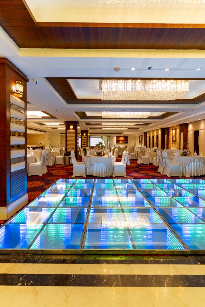 The illuminated dance floor, lit blue between the rounds