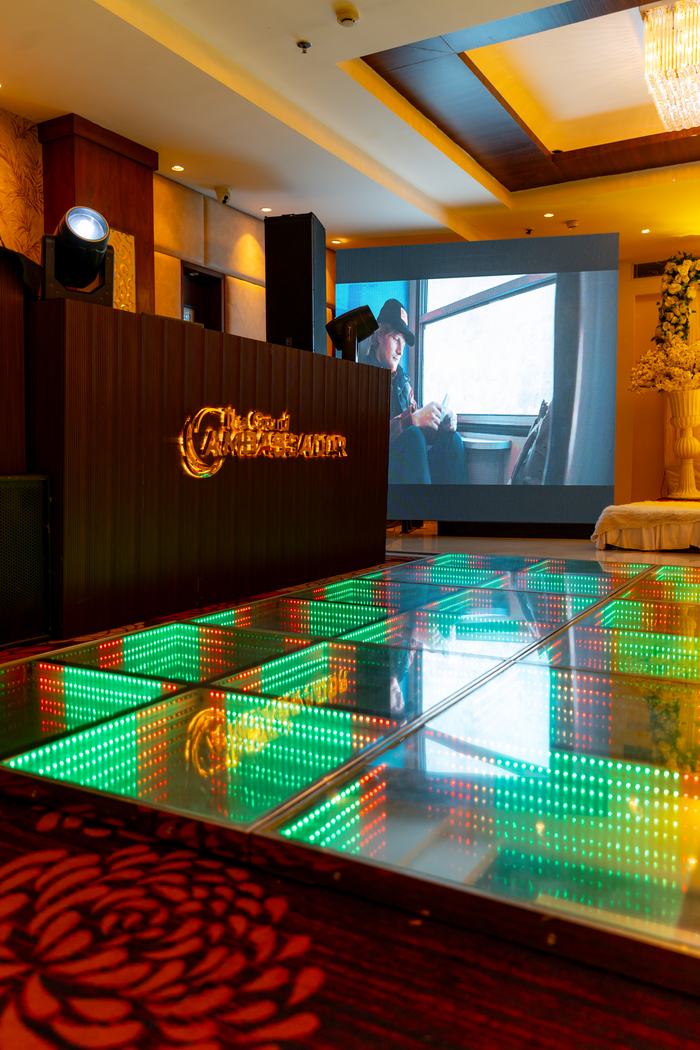 The dance floor lit green