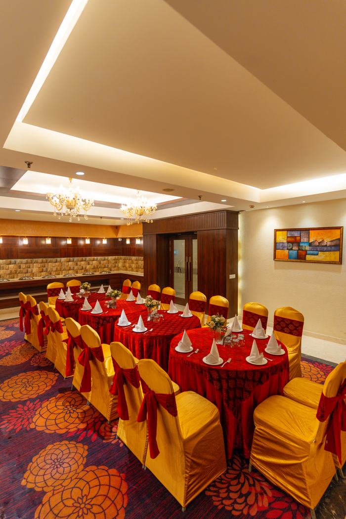 Red and gold banquet seating, set in rows