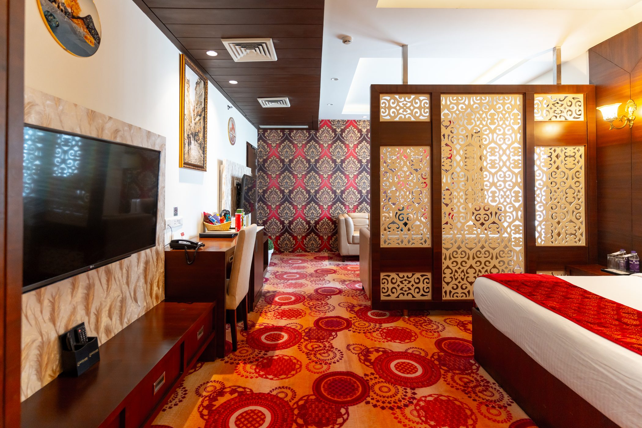Suite: The television wall beside the carved screen