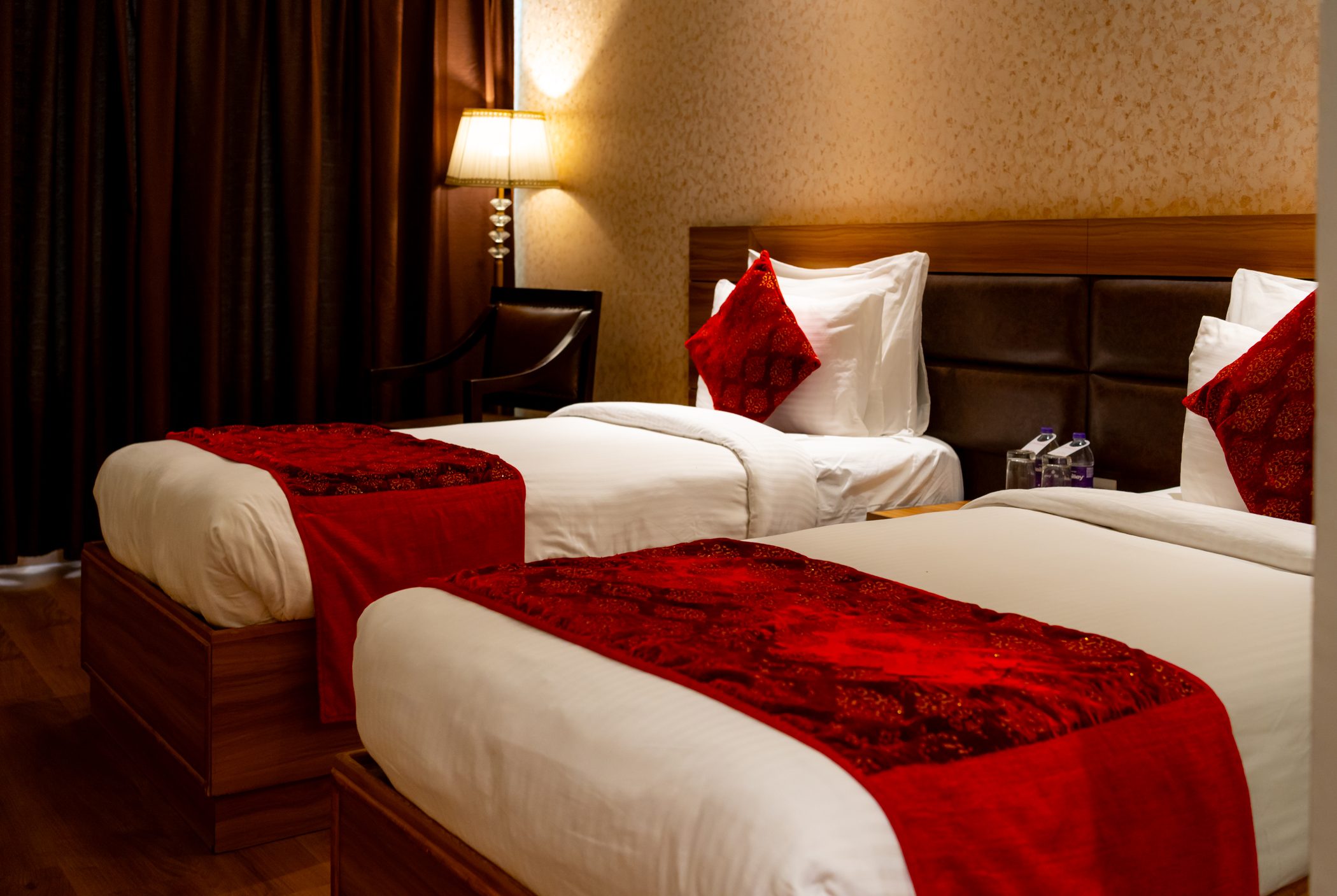 A Twin Room, red runners across both beds
