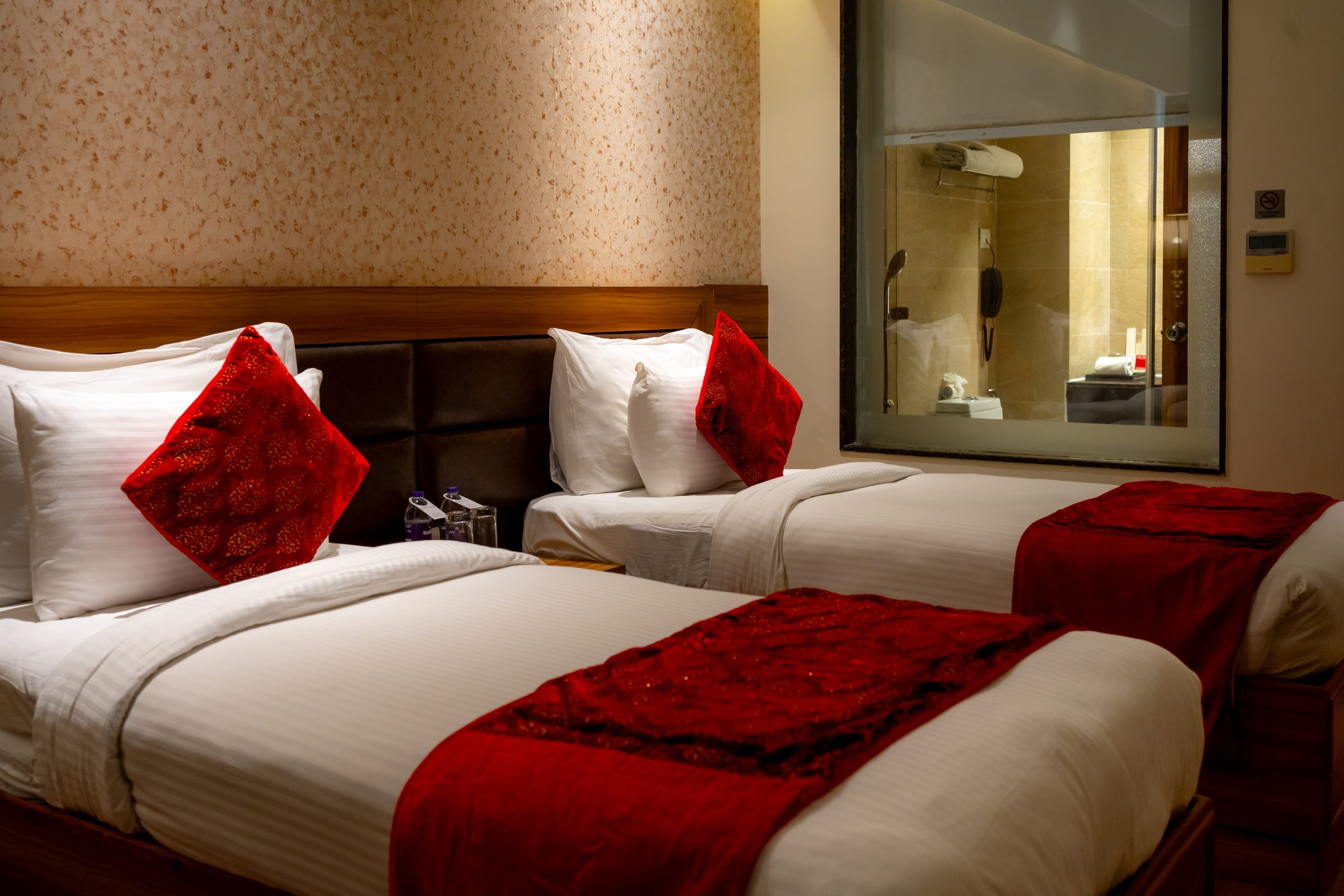 A Twin Room by lamplight, the mirror between the beds